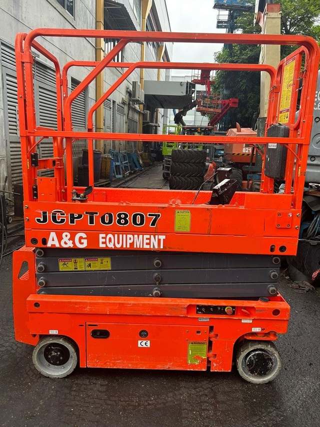 Dingli JCPT0807 battery scissor lift parked for a pre-use inspection before work in Johor