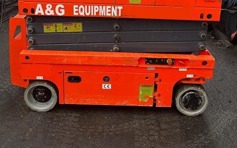 Dingli JCPT0807 battery scissor lift parked for a pre-use inspection before work in Johor