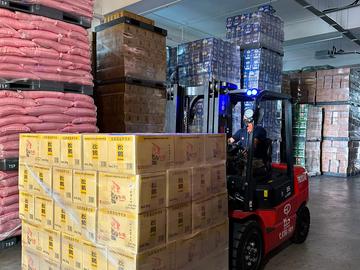 EP lithium-ion forklift moving pallets in a warehouse in Johor
