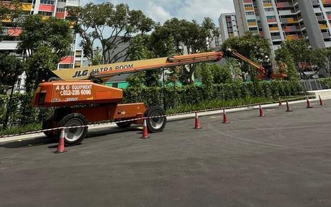 JLG Ultra Boom telescopic boom lift working on a large project site in Johor